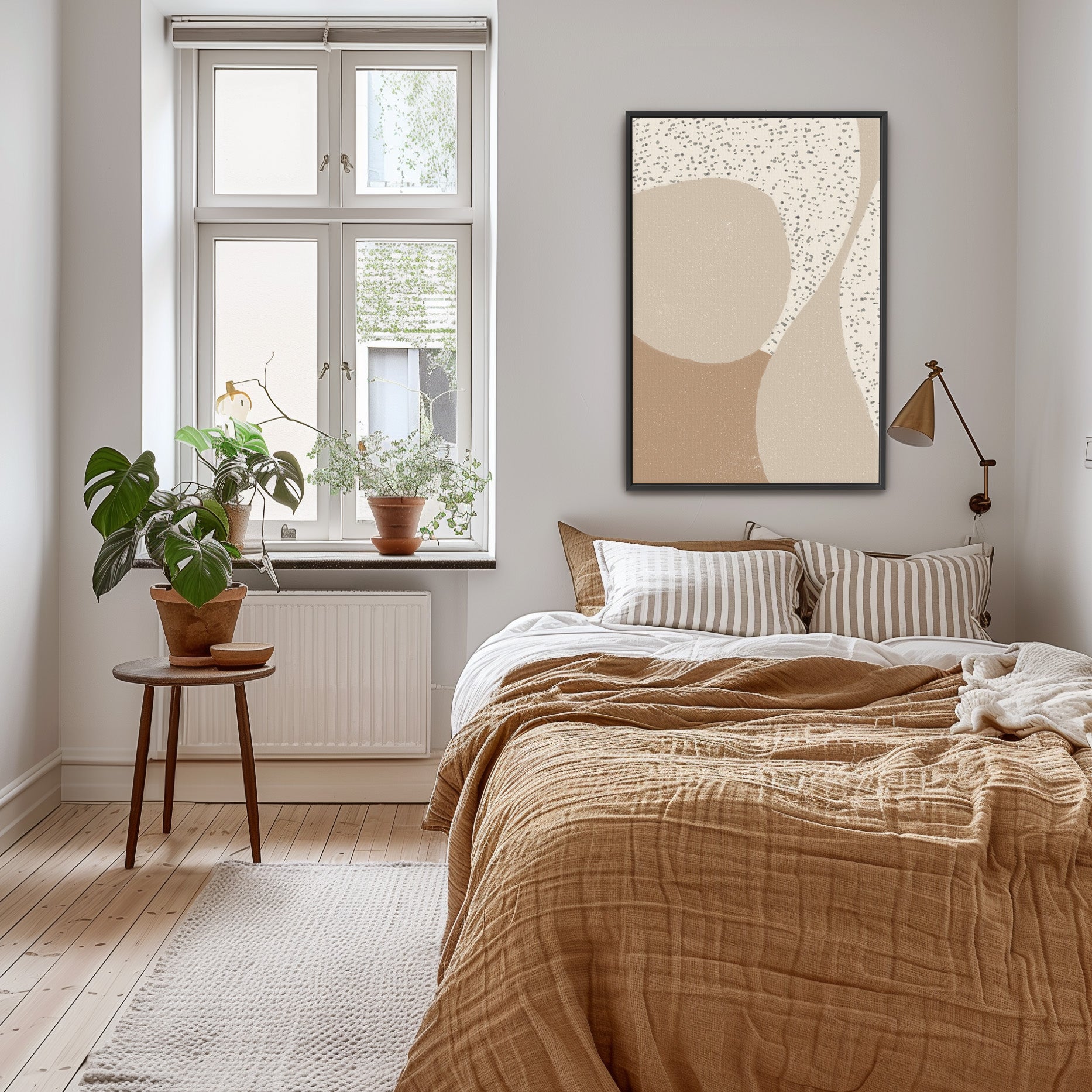 a bedroom with a bed and a painting on the wall