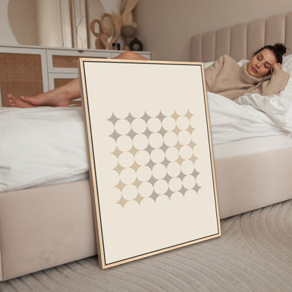 a woman laying on a bed next to a poster