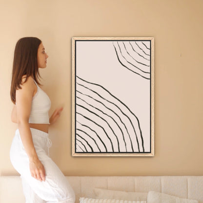 a woman standing in front of a painting on a wall