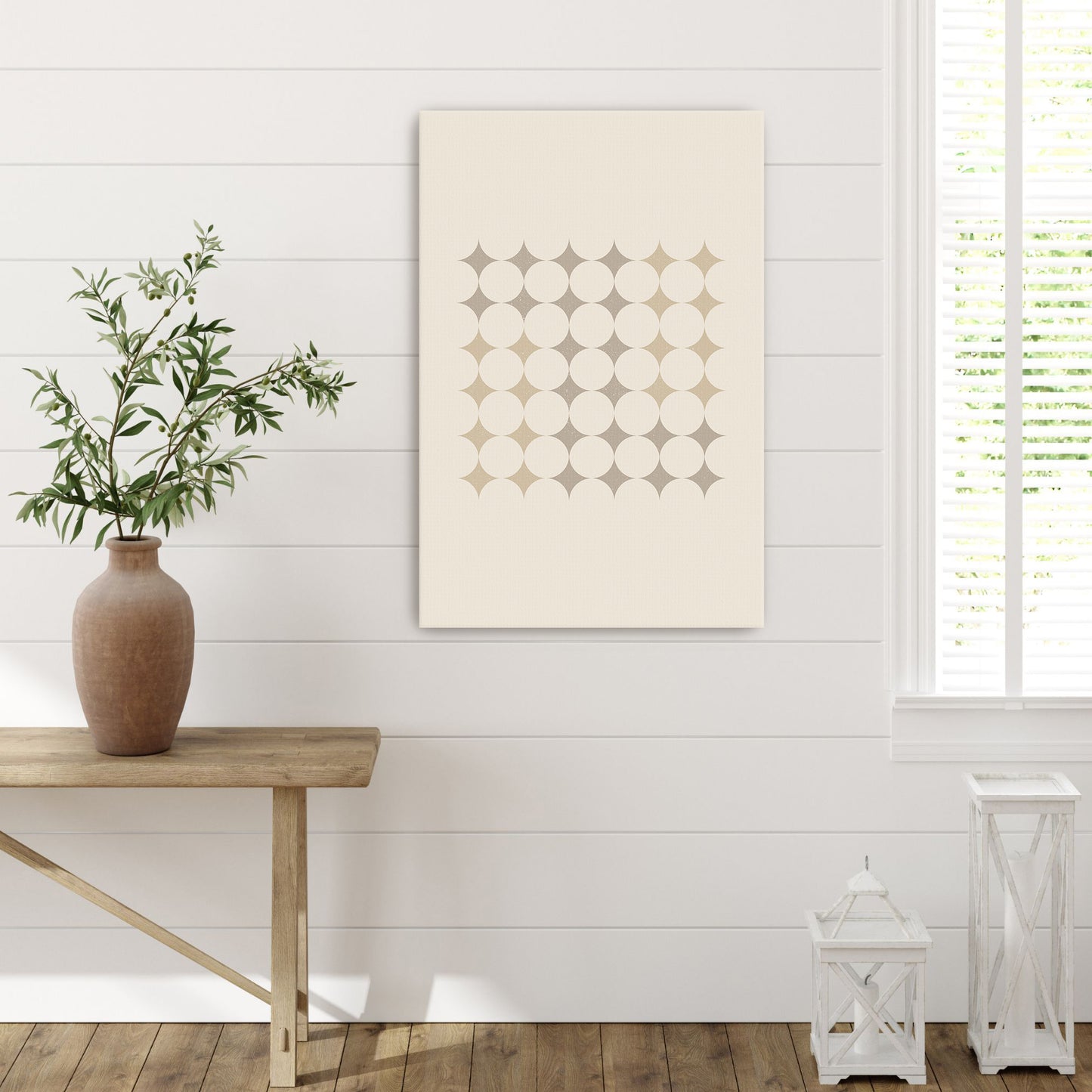 a vase with a plant on a table in a room